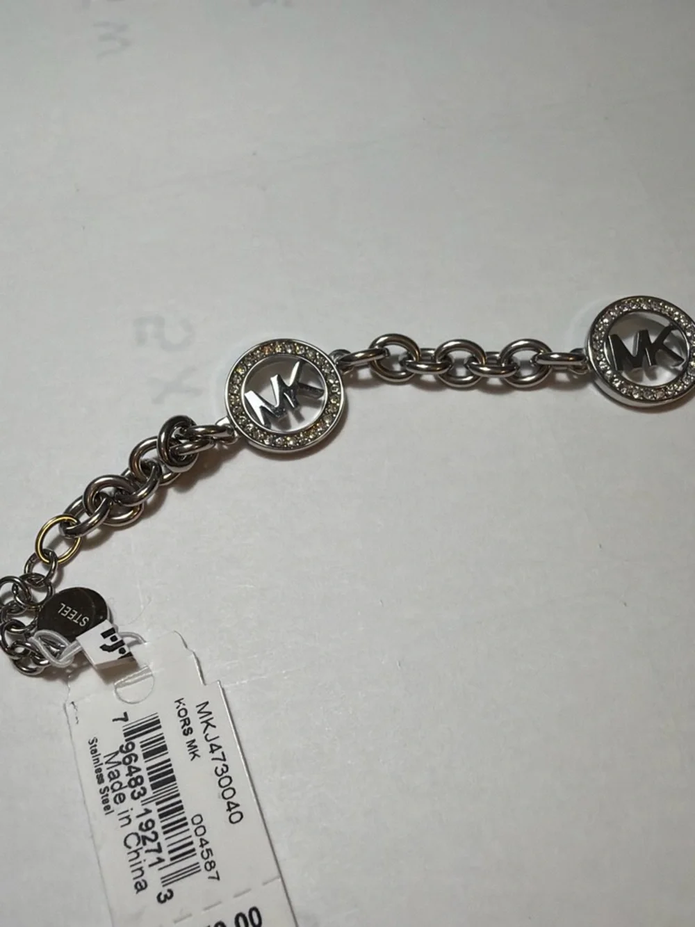 Michael Kors Silver-Tone MK Charm Chain Bracelet with Crystal Rings